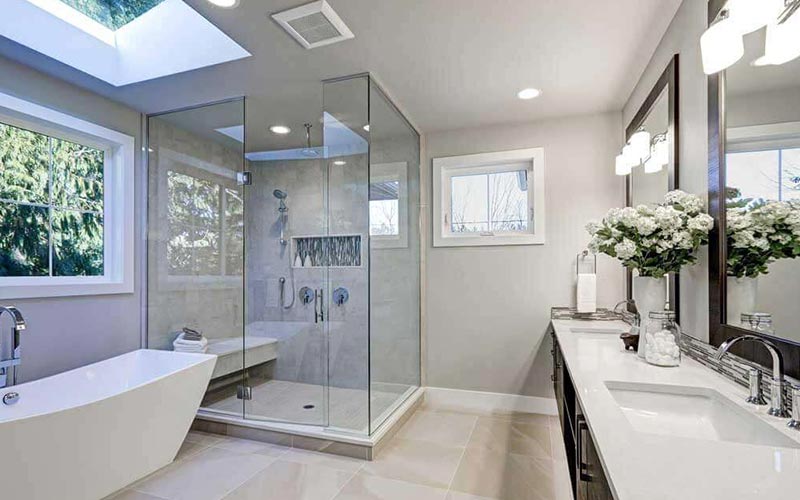 A newly finished bathroom installation with double vanity, walk-in shower and bath